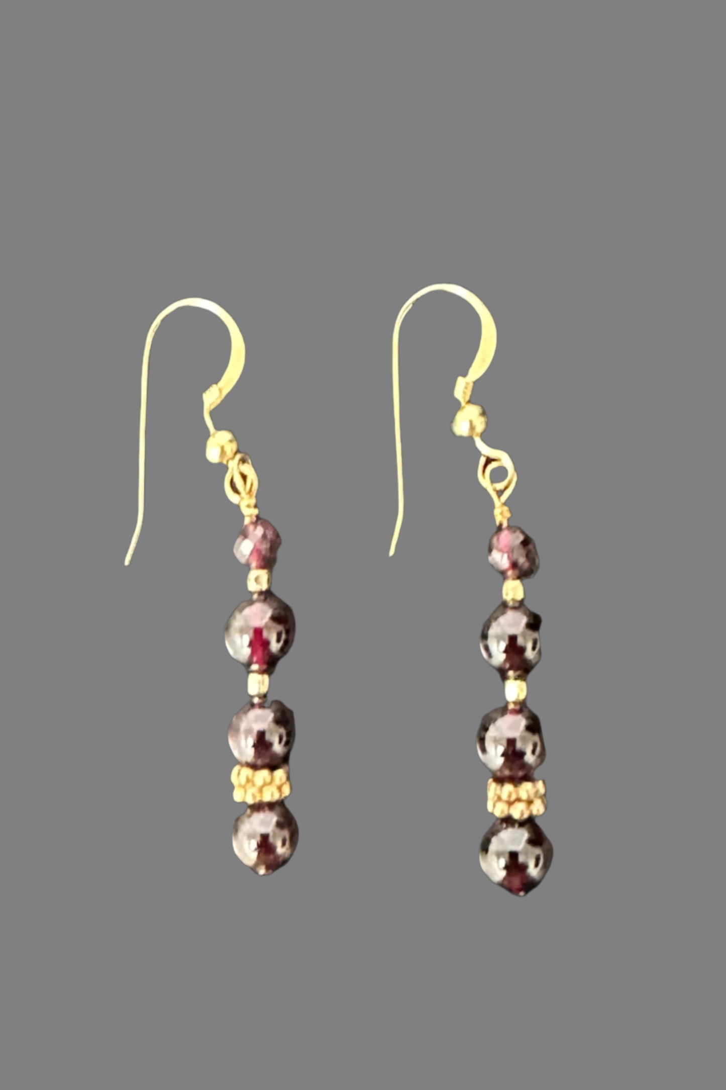 Capricorn Earrings, designed and created with Garnett gemstones, produced by AstroCreations, makers of unique Zodiac jewelry.