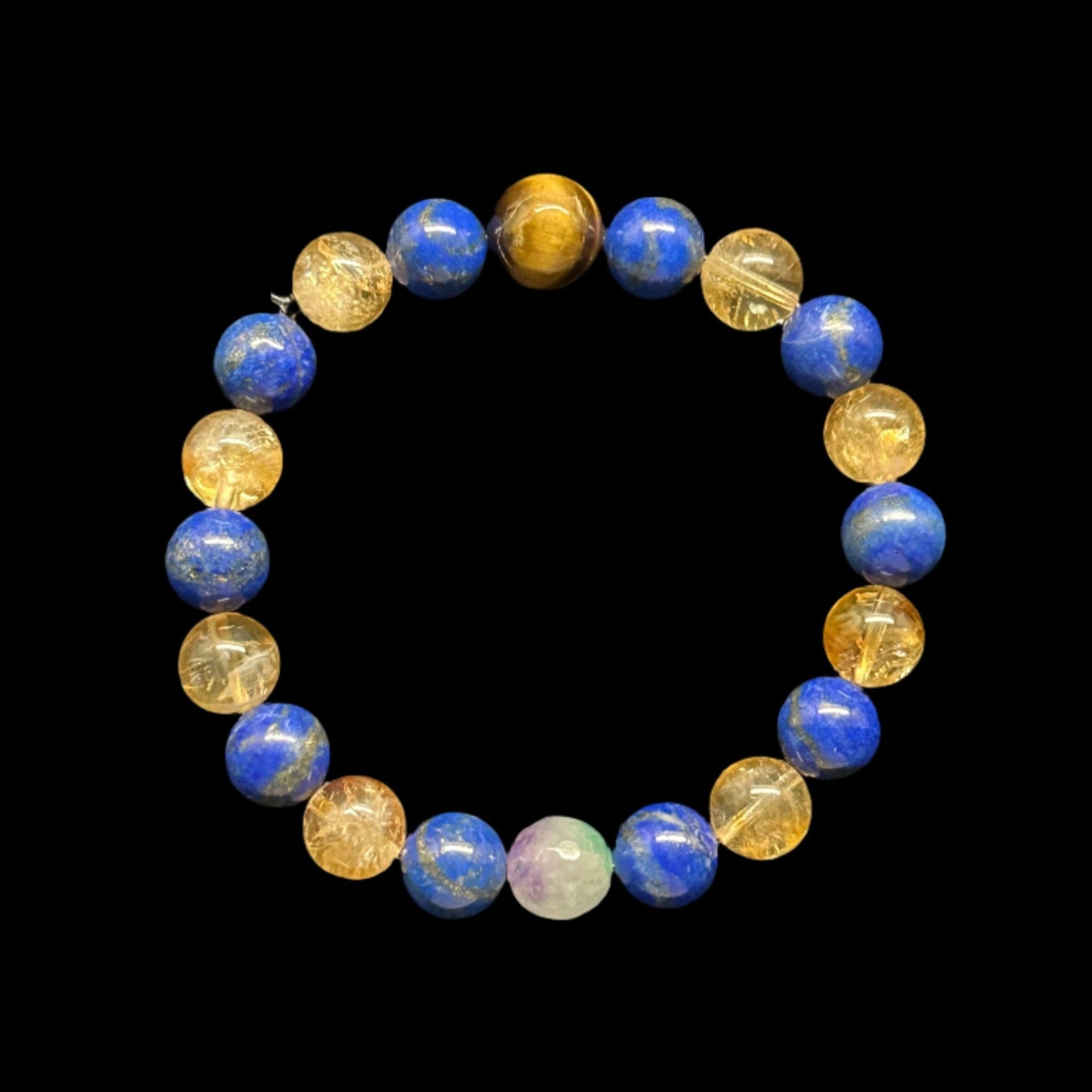 Aundance Bracelet. This bracelet was designed and produced by AstroCreations. This striking bracelet is designed with the following precious stones: Lapis Lazuli, Citrine, Kunzite and Tiger's Eye.