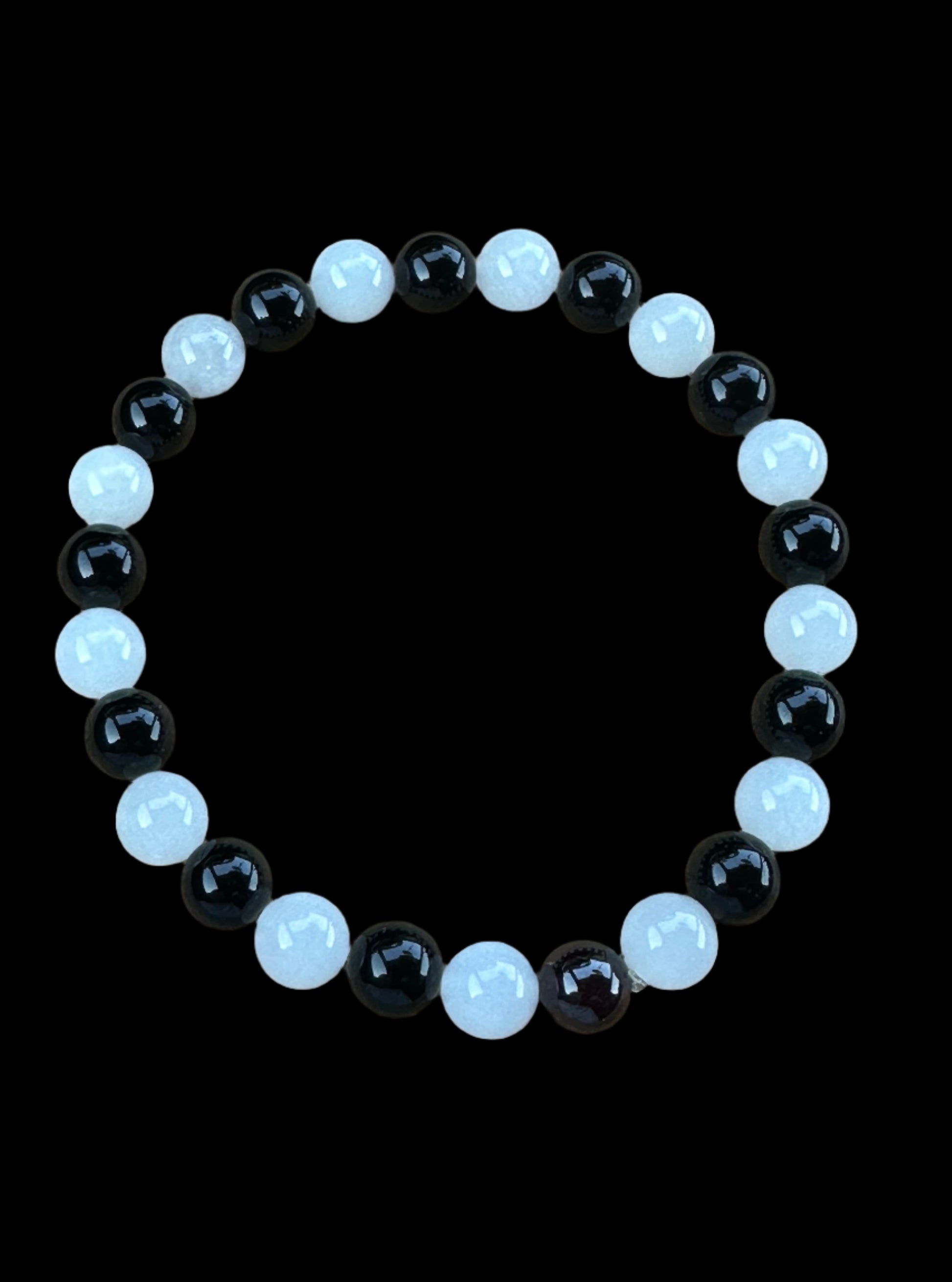 A 8" Capricorn Bracelet designed with Onyx and Moonstone gemstones.  Designed and produced by AstroCreations.  