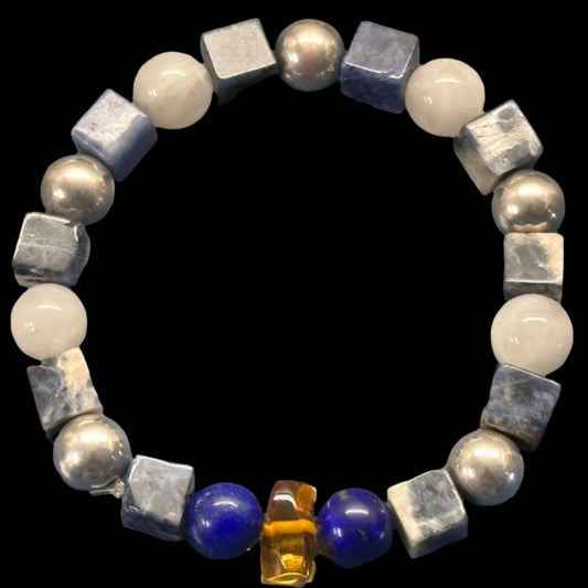 Pisces bracelet designed with semi-precious gemstones: Lapis lazuli, Sodalight, Moonstone, and silver-plated spacers,  produced by AstroCreations.  Makers of unique Zodiac jewelry.