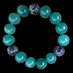 A semi-precious stones, turquoise and purple beaded bracelet designed and produced by AstroCreations.